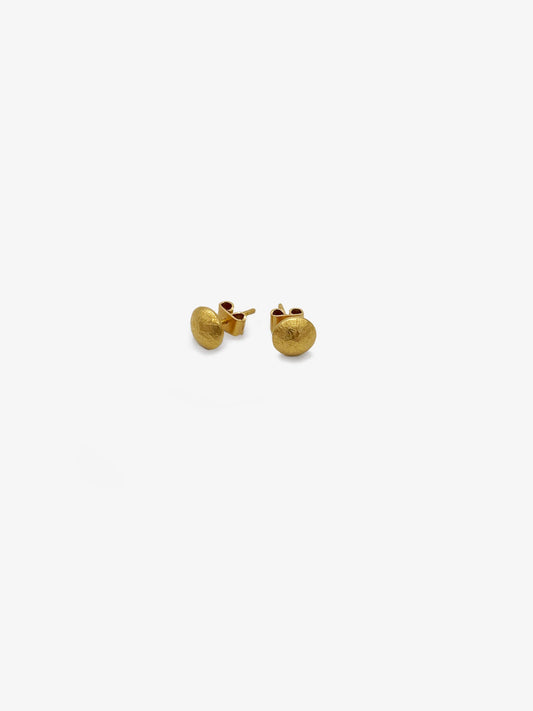 Round gold earrings by Rainer Beneke